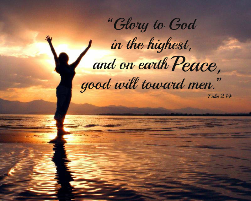 "Glory to God in the highest, and on earth peace, good will toward men." - Luke 2:14; A silhouette photo of a woman standing on the beach at sunset with her arms lifted in the air.