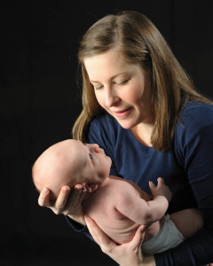 A photo of a new mother holding her baby.