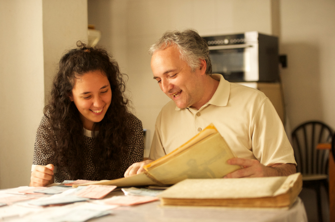 Father and daughter working on family history.