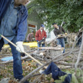 Serving others by cleaning up tree limbs