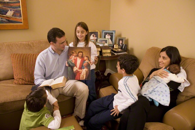 Parents teaching children about the gospel of Jesus Christ during Family Home Evening.