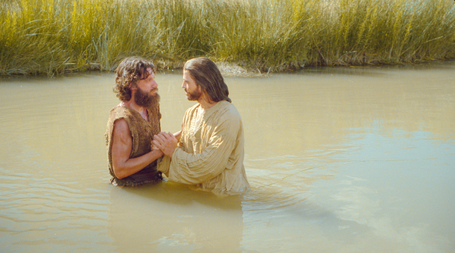 John the Baptist baptizing Jesus Christ.
