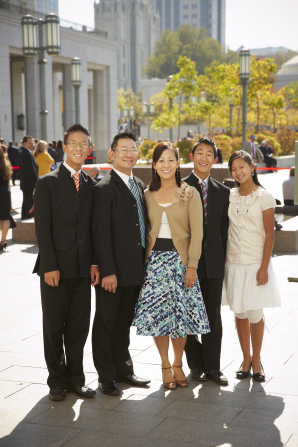 A family stands in front of the Conference Center in Salt Lake City during General Conference.
