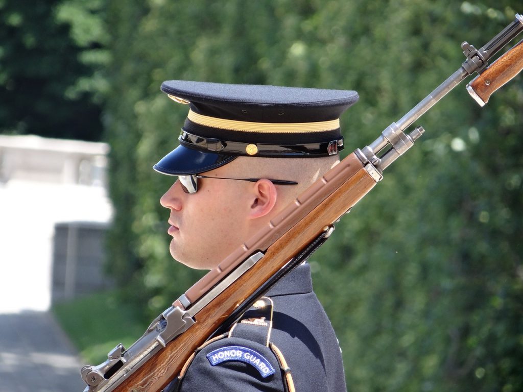 A soldier stands at the ready to defend his country.